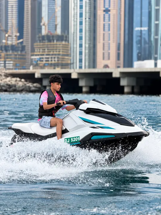 Jet Ski rider on the water beside the JBR waterfront